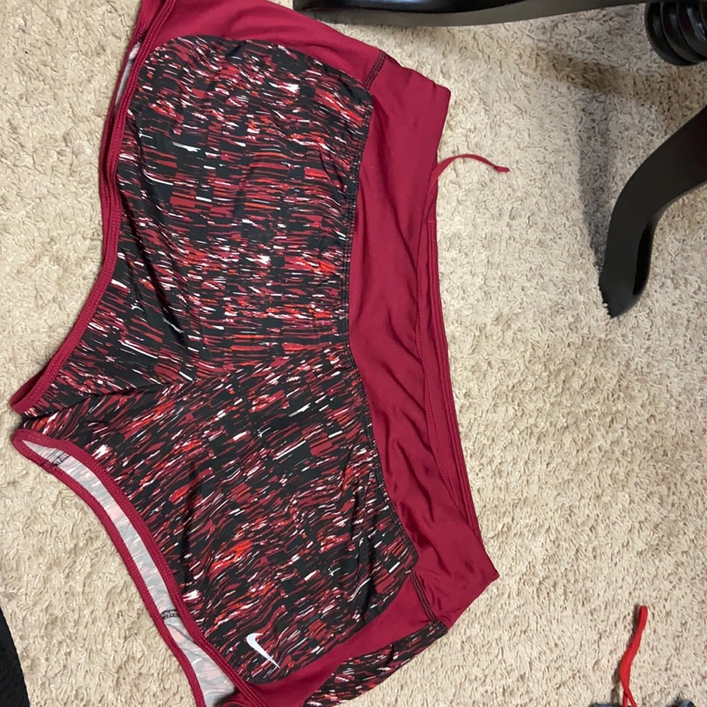 Red Nike running shorts
